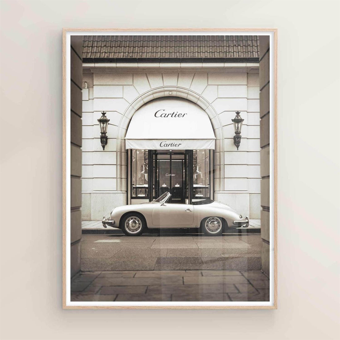 Luxury fashion poster featuring a vintage Porsche parked outside a Cartier store