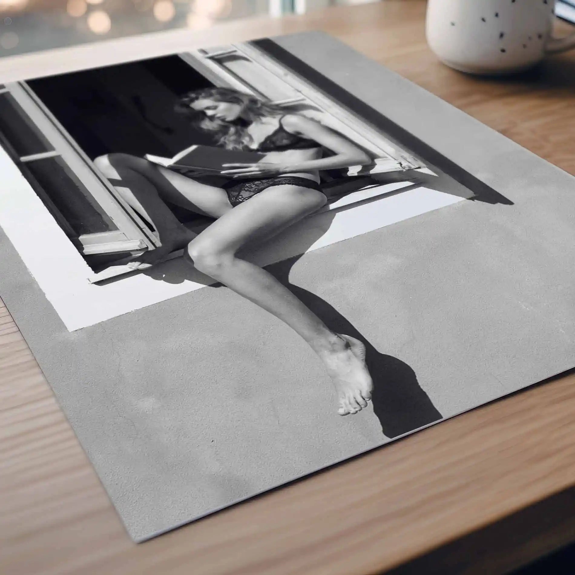 poster detail print featuring a girl reading a book at a french window artwork with monochrome tones and luxury French New Wave vibe. by AfterHours Gallery