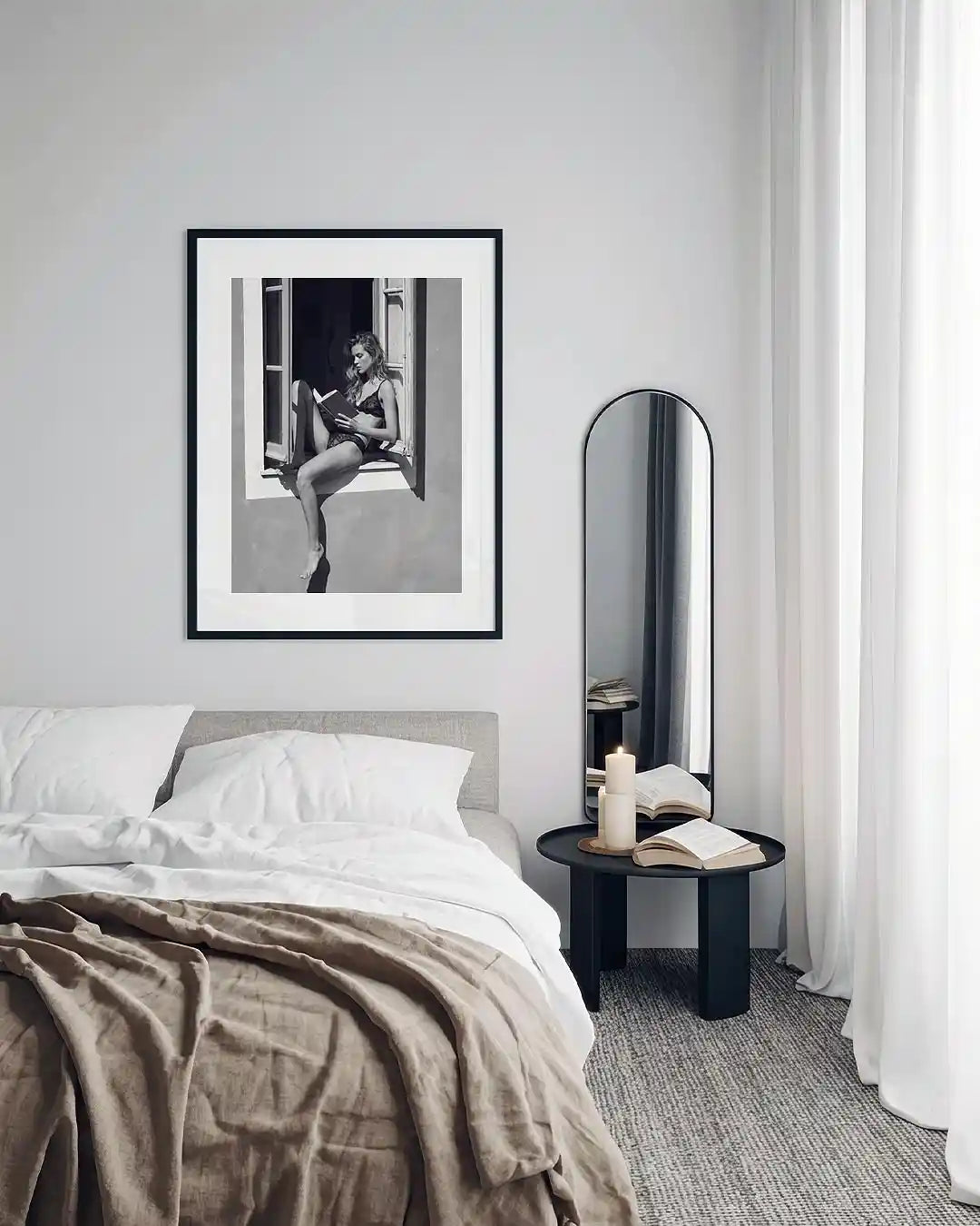 black framed poster print featuring a girl reading a book at a french window artwork with monochrome tones and luxury French New Wave vibe. by AfterHours Gallery