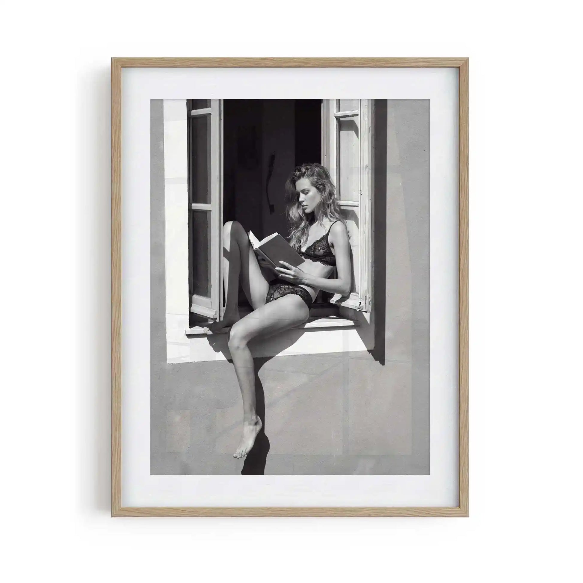 black framed poster print featuring window seat artwork with monochrome tones and luxury bedroom aesthetic by AfterHours Gallery