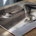Close-up of a person wearing white sneakers on a reflective surface.