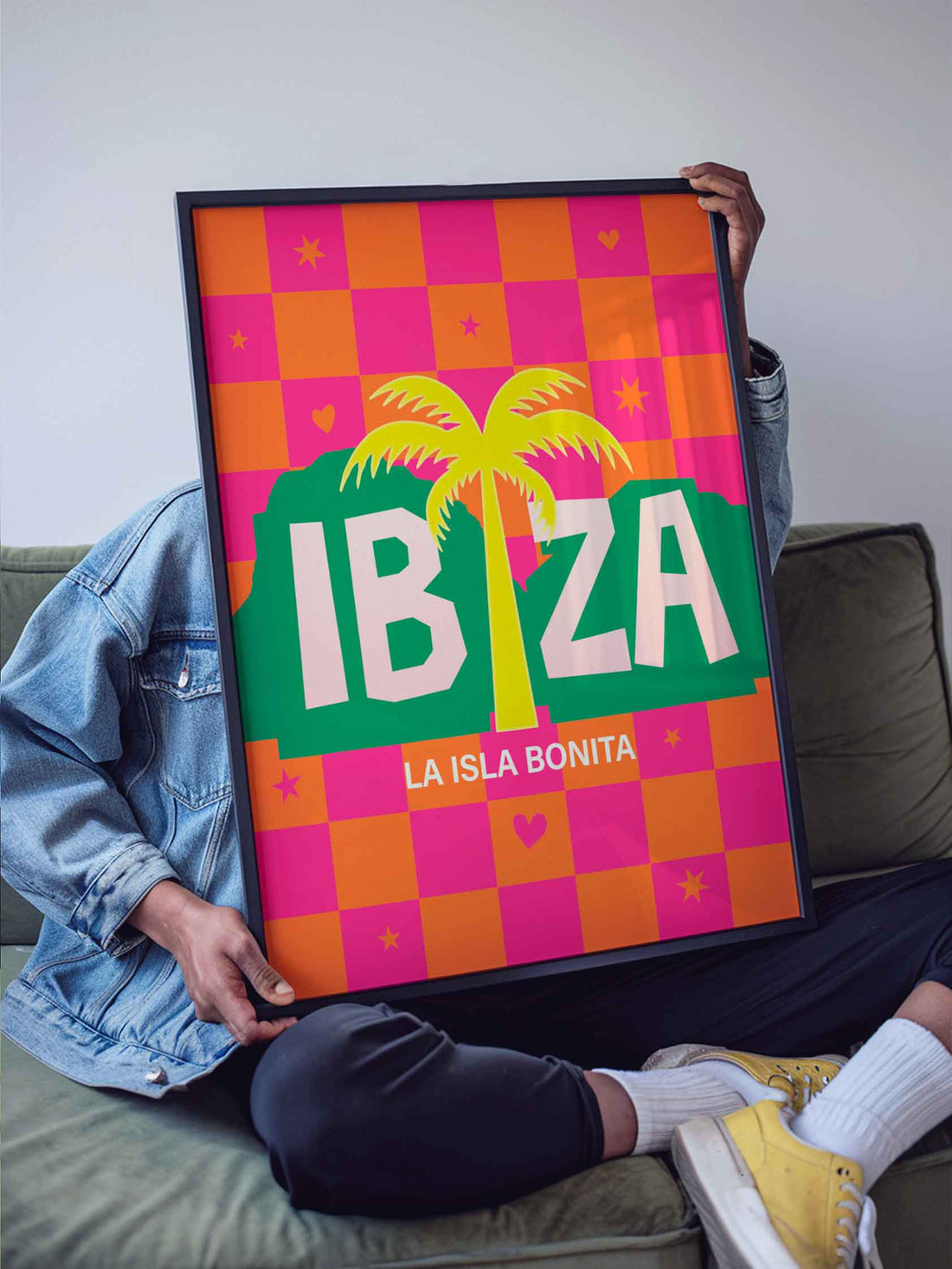 A maximalist retro wall art print celebrating the spirit of Ibiza -  hot pink checkerboard skies, tropical palm silhouettes and iconic Balearic energy.
