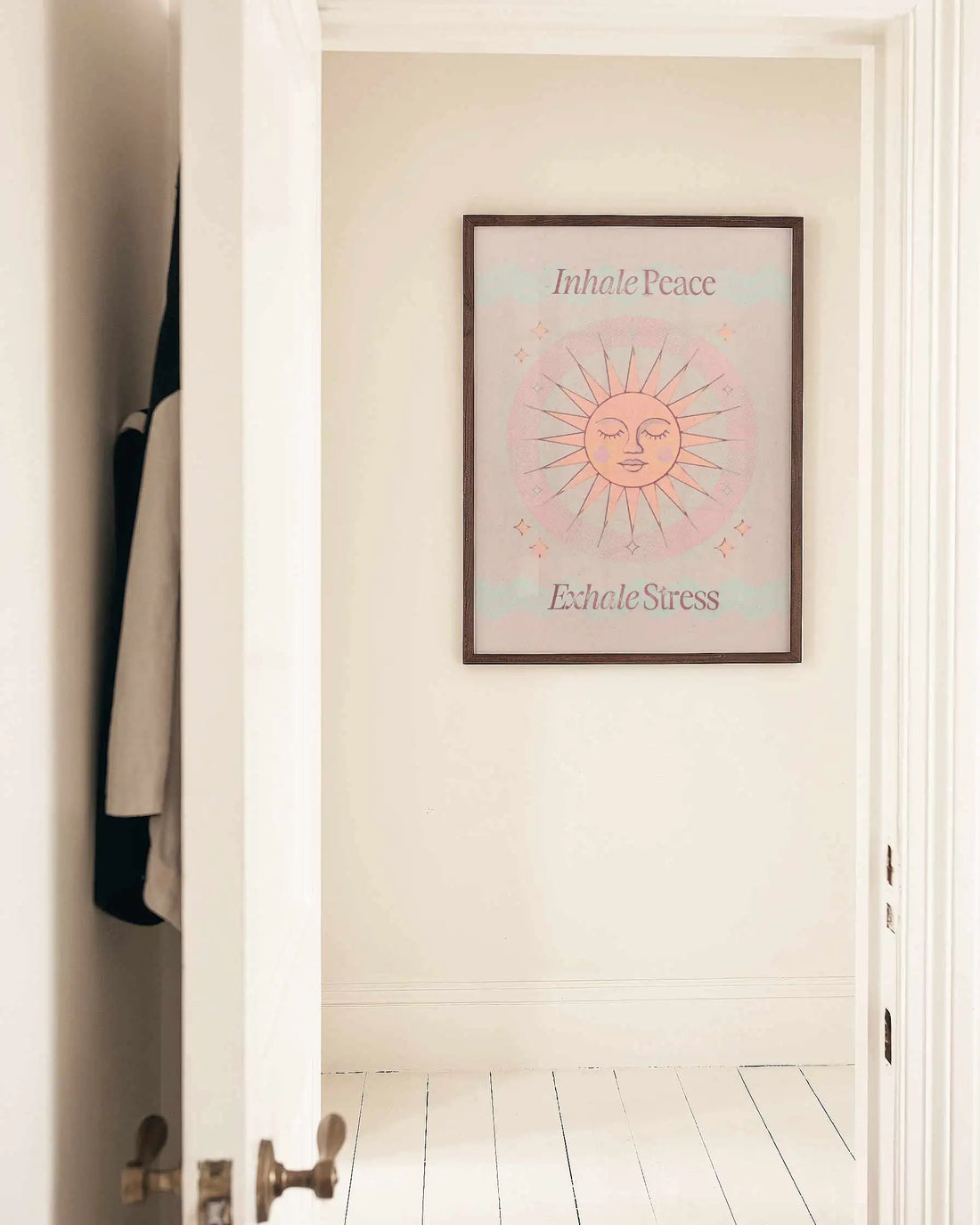 Inhale Peace, Exhale Stress mindfulness wall art print displayed in a minimalist brown frame with warm neutral tones.