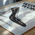 Minimalist black and white poster featuring a giant stiletto