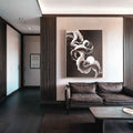 Modern living room with a brown leather sofa and japandi abstract wall art.