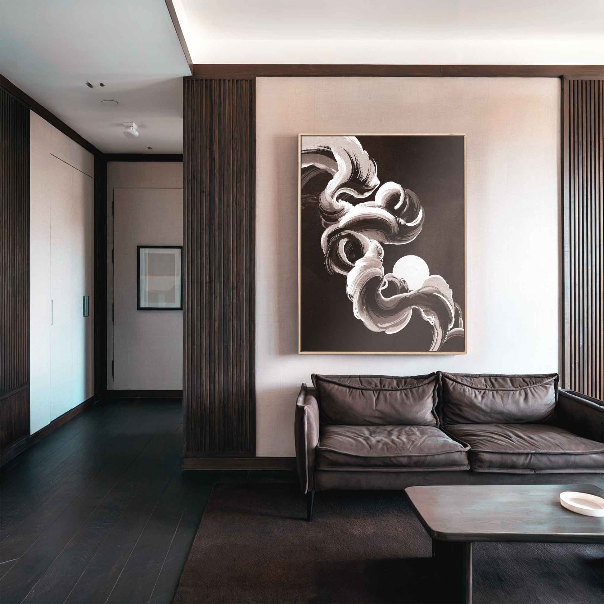 Modern living room with a brown leather sofa and japandi abstract wall art.