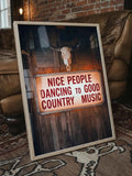 Rustic western wall decor with vintage illuminated sign and Americana country aesthetic framed by Afterhours Gallery
