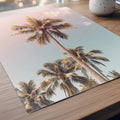 Poster detail Tall tropical palm tree photographed against a soft pink and blue pastel sky, creating a dreamy coastal wall art print inspired by endless summer living.