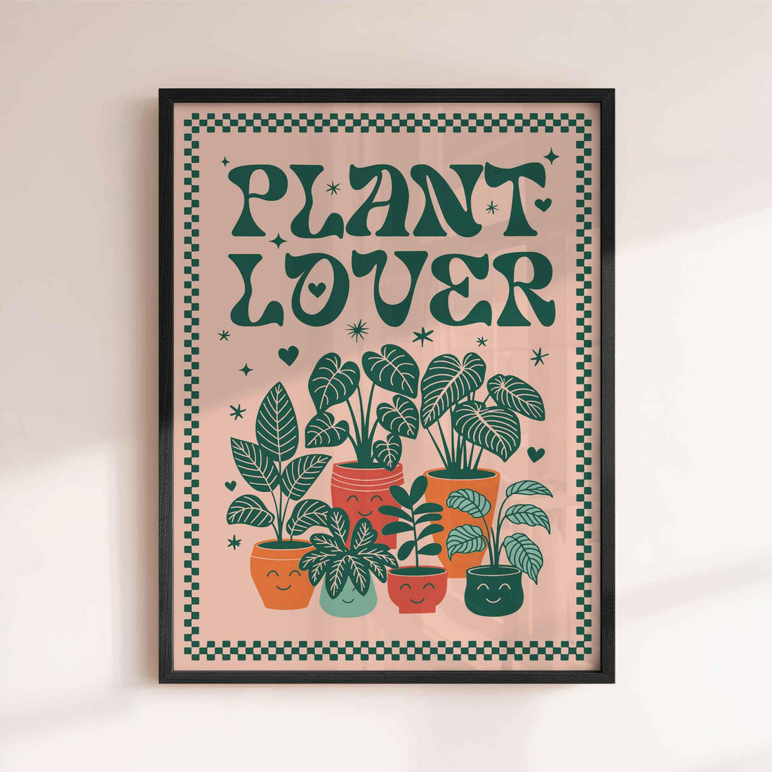 Framed poster with 'Plant Lover' text and illustrations of potted plants on a beige background. afterhours gallery
