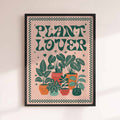 Framed poster with 'Plant Lover' text and illustrations of potted plants on a beige background. afterhours gallery
