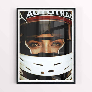 Framed print on a gallery wall with racing memorabilia