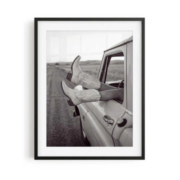 Road Trip is a western photography framed print featuring cowgirl boots and a vintage truck. Rustic Americana wall art for country, ranch and modern western interiors.