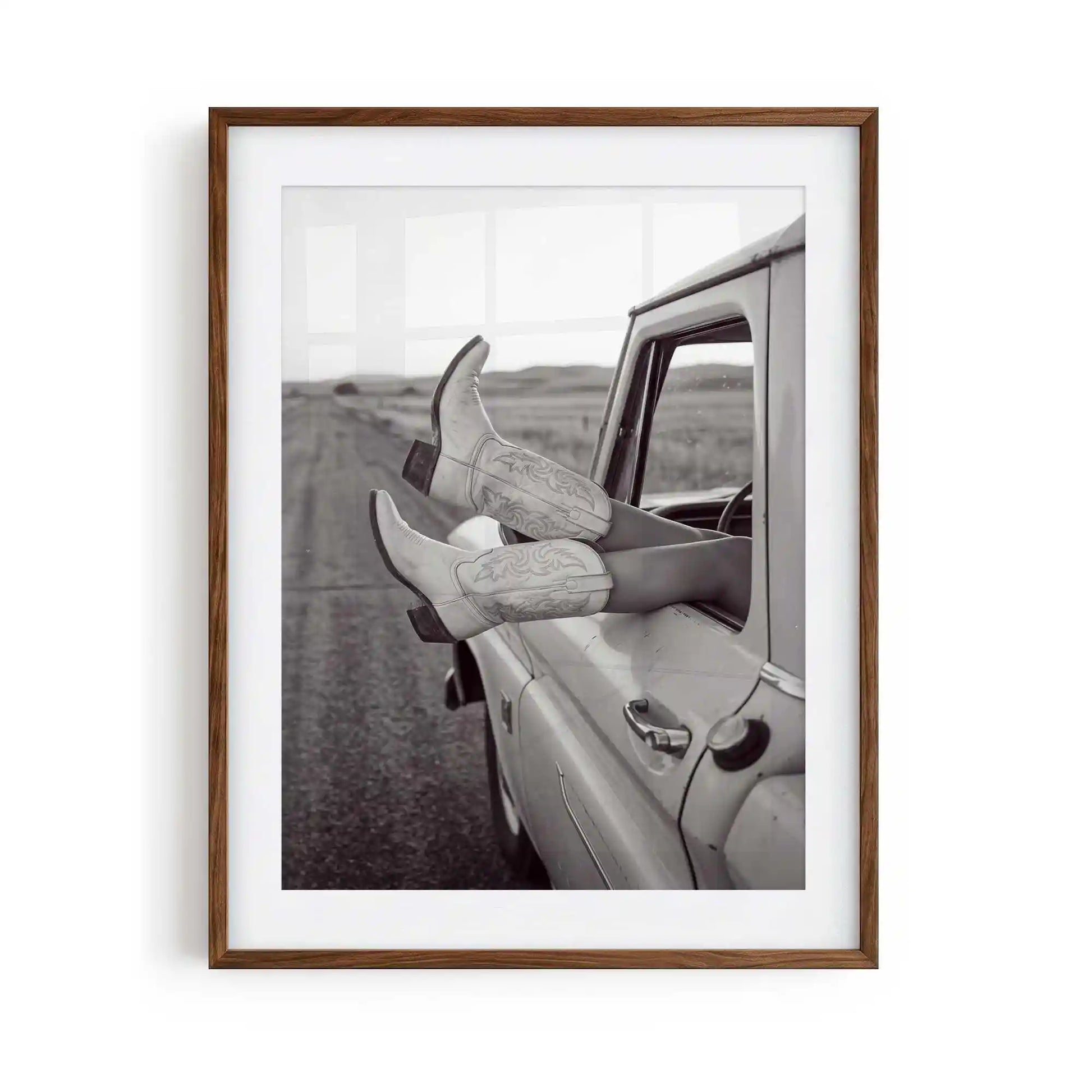 Road Trip is a western photography framed print featuring cowgirl boots and a vintage truck. Rustic Americana wall art for country, ranch and modern western interiors.