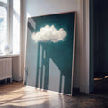 A surreal minimalist framed print featuring a single cloud floating in teal. 