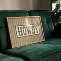 Howdy western typography framed wall art with vintage cowboy lettering