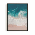 Aerial beach photography print showing turquoise ocean waves washing onto soft sandy shores in a calming coastal scene.