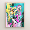 Vivid maximalist leopard poster hanging as bold bathroom wall art for trendy decor.