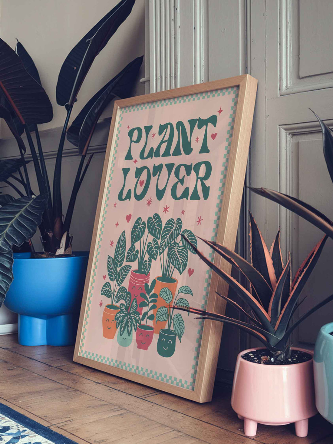 Whimsical retro botanical print featuring playful typography and smiley potted plants. Plant Lover poster