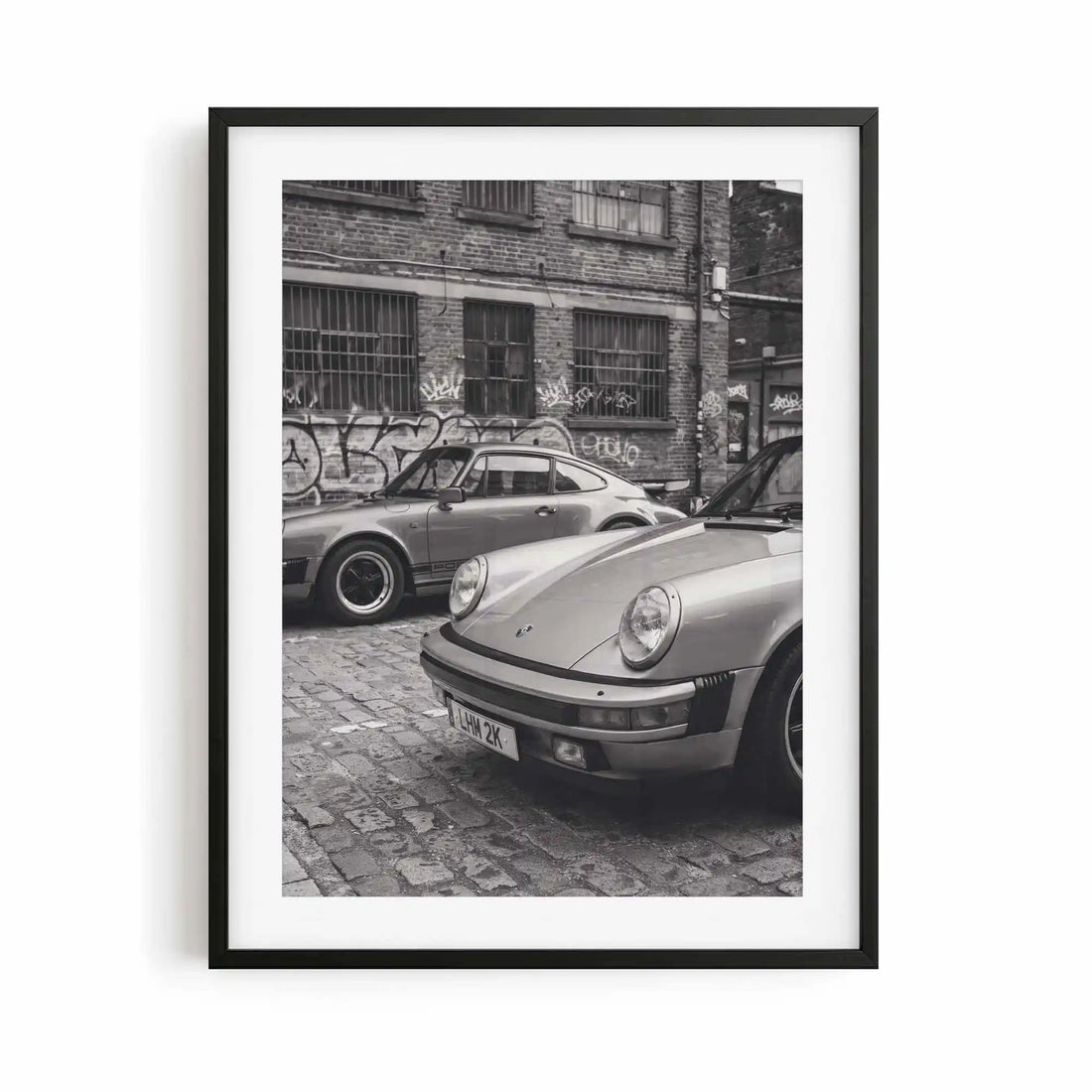 Nine Eleven Porsche 911 black and white photography print displayed in a contemporary black frame.