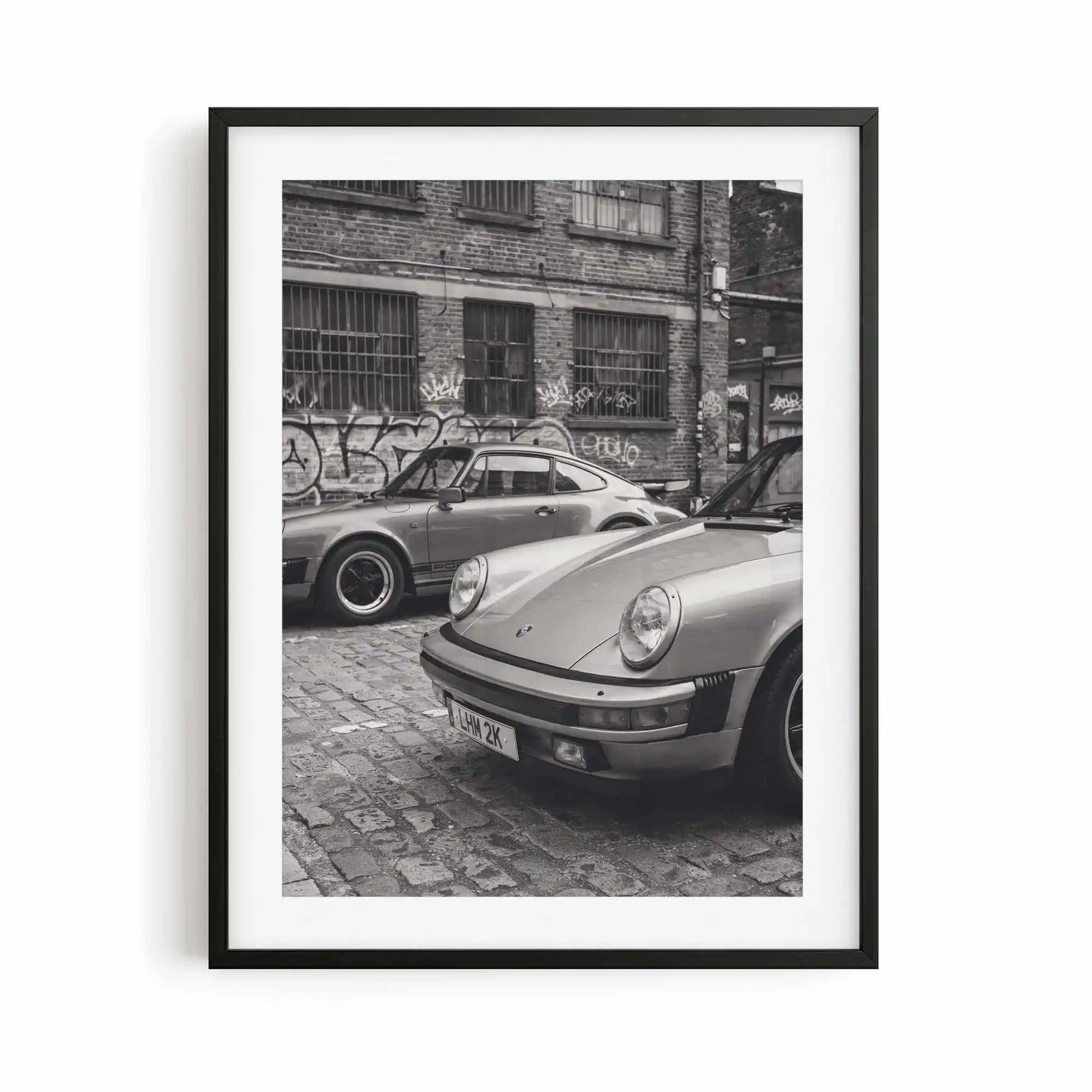 Nine Eleven Porsche 911 black and white photography print displayed in a contemporary black frame.